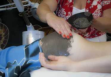 Young woman getting butt facial at day spa in Phoenix, AZ