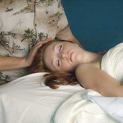 Massage therapist performing massage on woman in Chandler, AZ